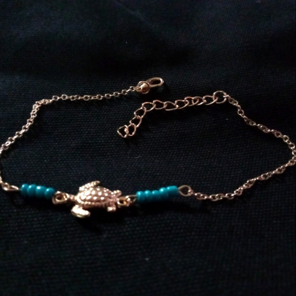Gold "turtle" with blue beads